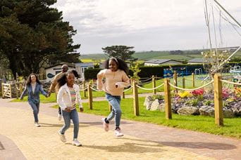 Kids running through Newquay Holiday Park