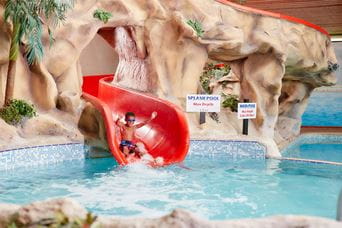 A boy sliding down the waterslide at Vauxhall Holiday Park in Norfolk