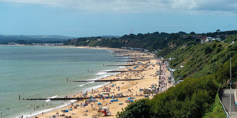 Sunbathers and summer crowds on Bournemouth Beach