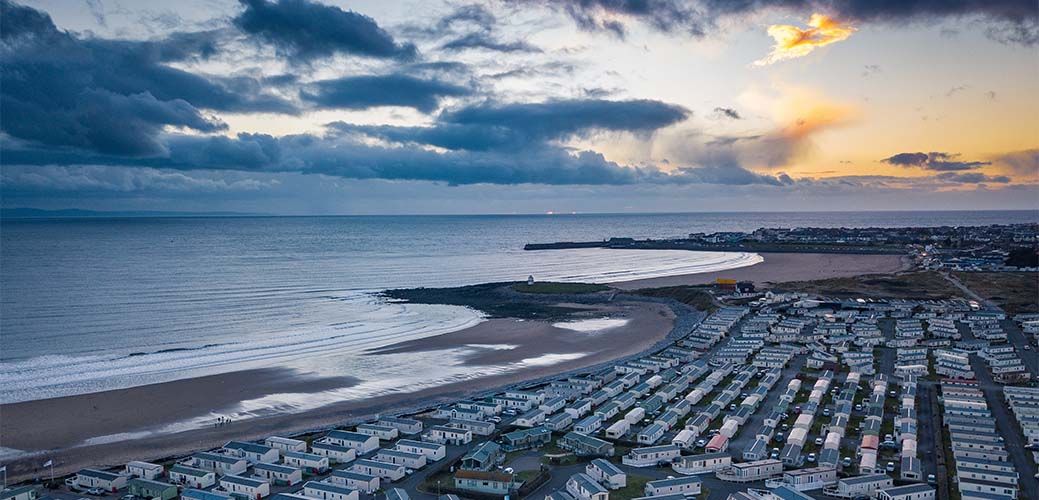 A view over Trecco Bay Beach and Holiday Park at sunset