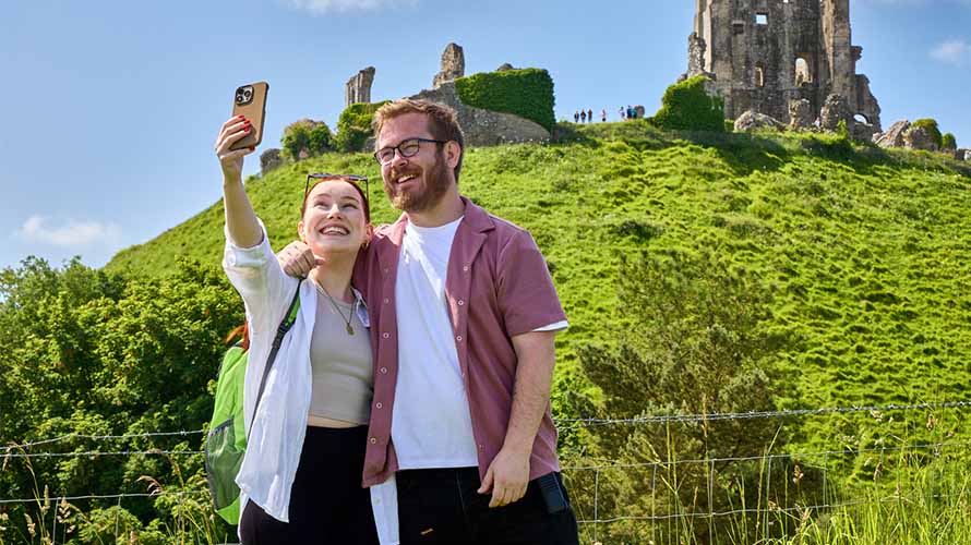 A couple posing for a selfie while exploring Dorset's attractions