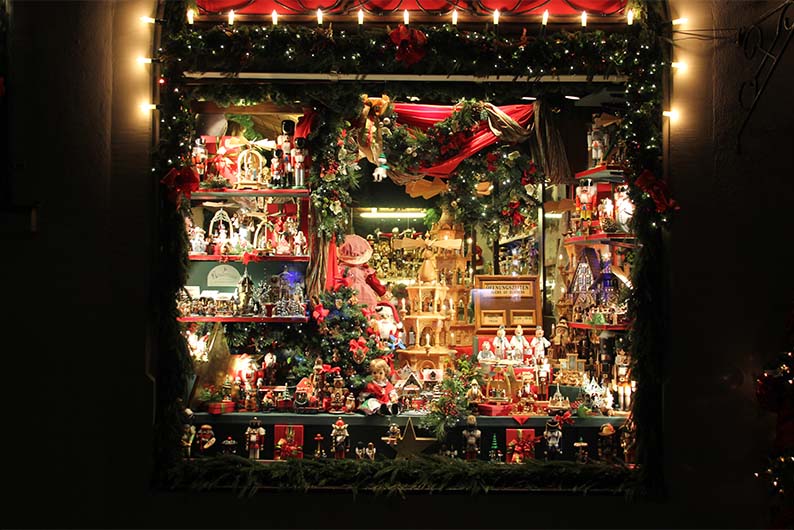 A display of Christmas ornaments in a shop window