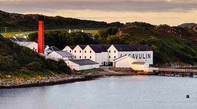 Distillery by a lake in Scotland