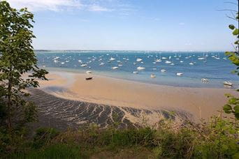 Boats moored in the waters off Studland Bay
