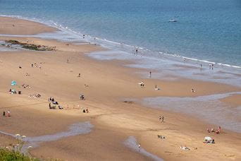 Families enjoying Whitby Sands Beach in Yorkshire