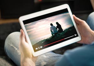 Someone watching a video on a tablet