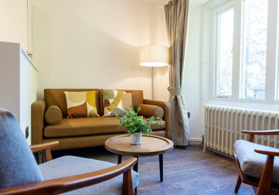 Cosy living room with brown sofa and coffee table
