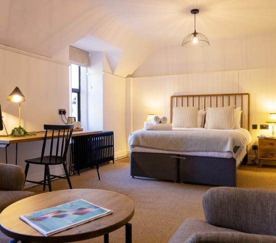 Kinf size bedroom with neutral furnishings