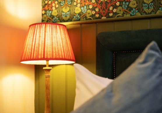 Pink lamp shade with bright bulb
