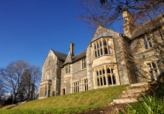 Fallbarrow Hall standing tall in the clear blue sky