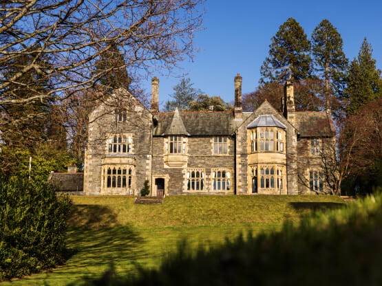 Fallbarrow Hall standing tall in the clear blue sky