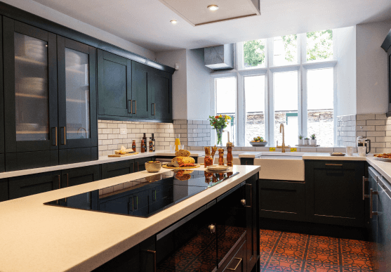 Shaker navy blue style kitchen with classing white subway tiles 