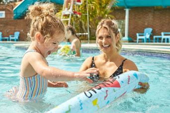 Family in swimming pool
