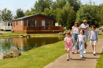 Family walking through Parkdean Resorts