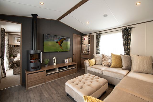 The stylish lounge and flat screen TV of the Carnaby Langdale Central Lounge Caravan