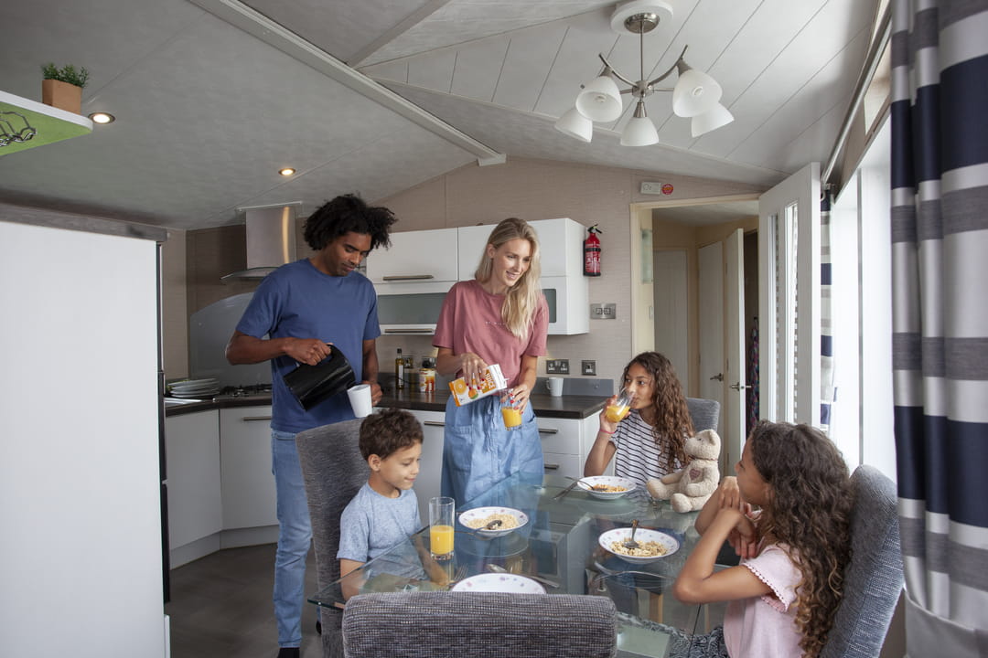 A family relaxing in a caravan