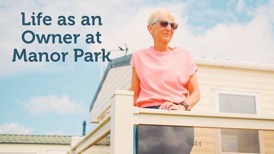 Woman stood on a veranda at Parkdean Resorts