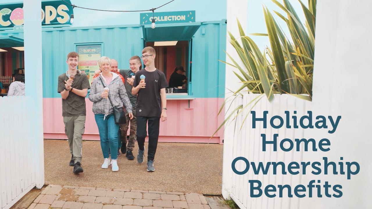 Family walking through parkdean resorts eating an ice cream