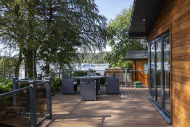 A luxury lodge for sale overlooking a lake in the Lake District