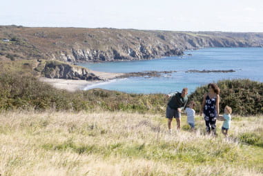 a family overlooking a beach