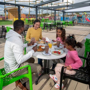 Family enjoying food at Parkdean Resorts