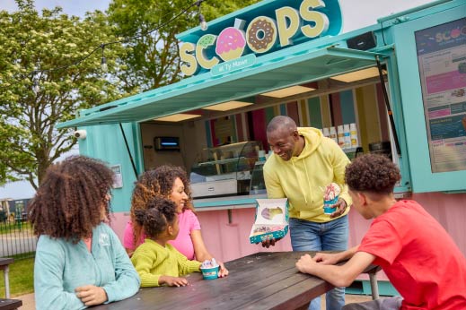 Family enjoying ice cream a Scoops at Parkdean Resorts