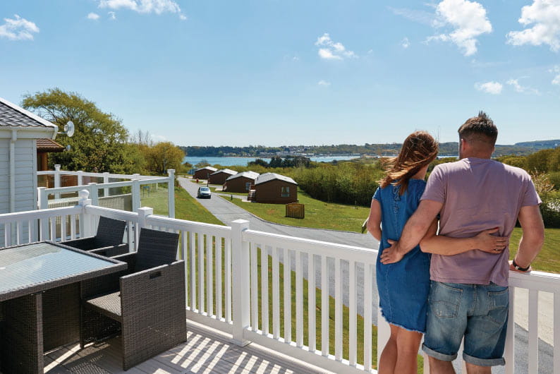 couple on veranda of a caravan