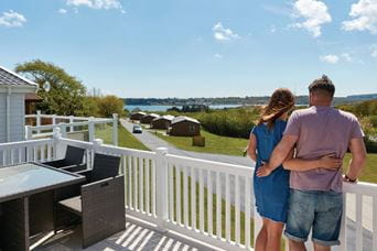 couple on veranda of a caravan