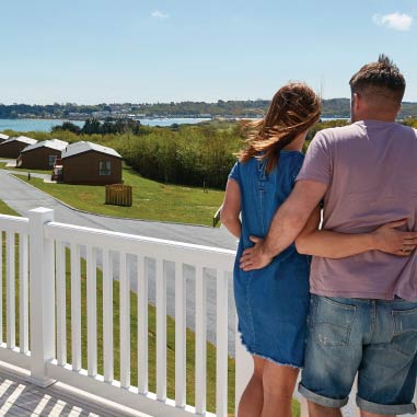 couple standing together on a lodge veranda