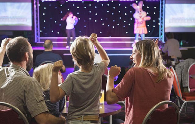 Family enjoying Starland Krew on stage at Parkdean Resorts