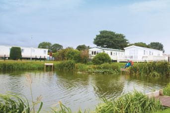caravans overlooking a lake