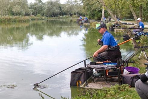 a man fishing at a lake