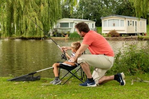 a man a son fishing at a lake