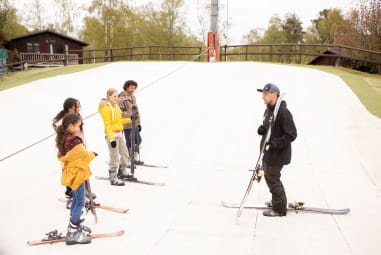 family at Warmwell holiday park on outdoor ski slope