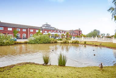 Hotel by pond