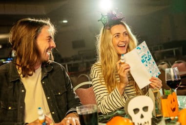 Couple sitting with Halloween decorations