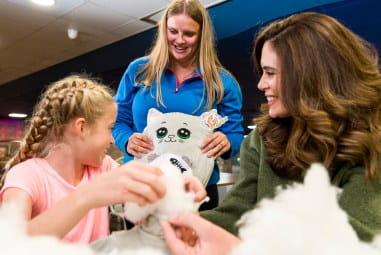 Children playing with stuffed toys
