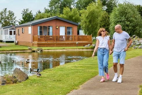 Couple walking by lake