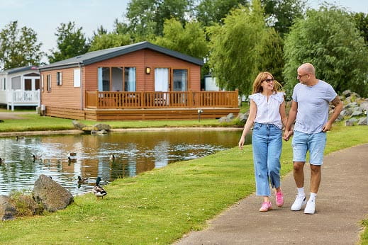 Couple walking by lake