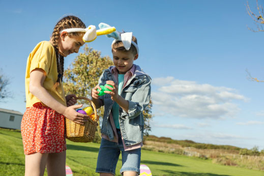 Children with Easter ears on an egg hunt