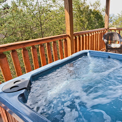 A hot tub on a wooden veranda