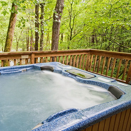 A hot tub on a wooden veranda