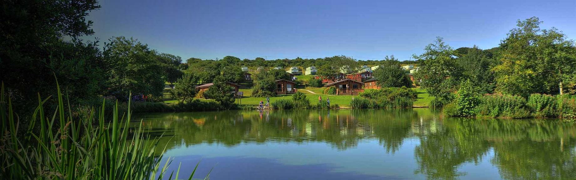 Lakeside lodges at White Acres Holiday Park in Cornwall