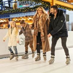 Family on ice skating rink