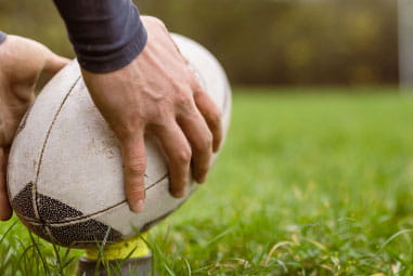 rugby ball being placed on the ground