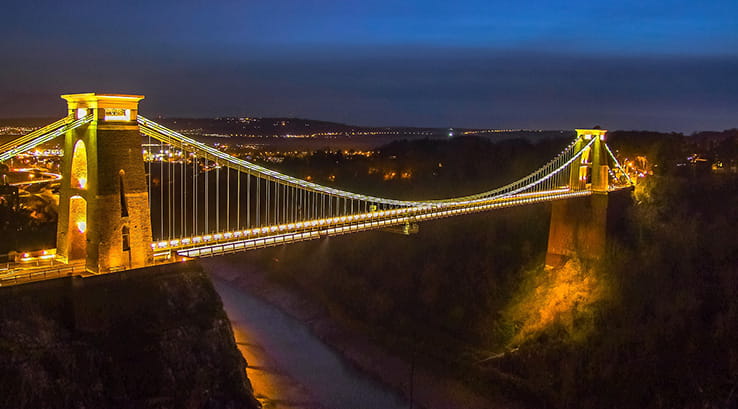 The Clifton Suspension Bridge in Bristol, lit up at night