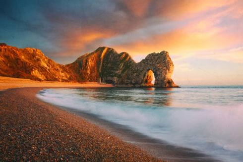 a beautiful picture of a prehistoric cliff face in the sunset