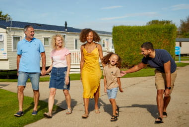 family walking down a path of a holiday park
