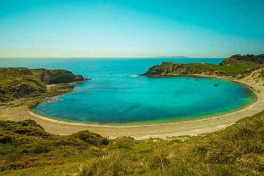 Lulworth Cove, with deep blue sea and sky
