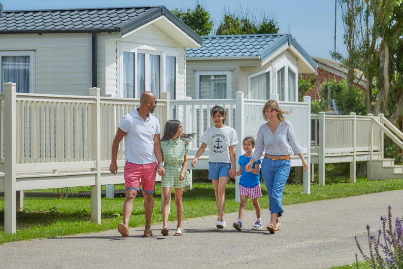 family walking down a path at a holiday park